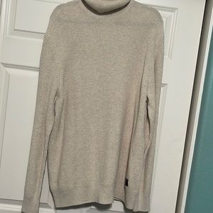 Cream colored turtleneck, long sleeve